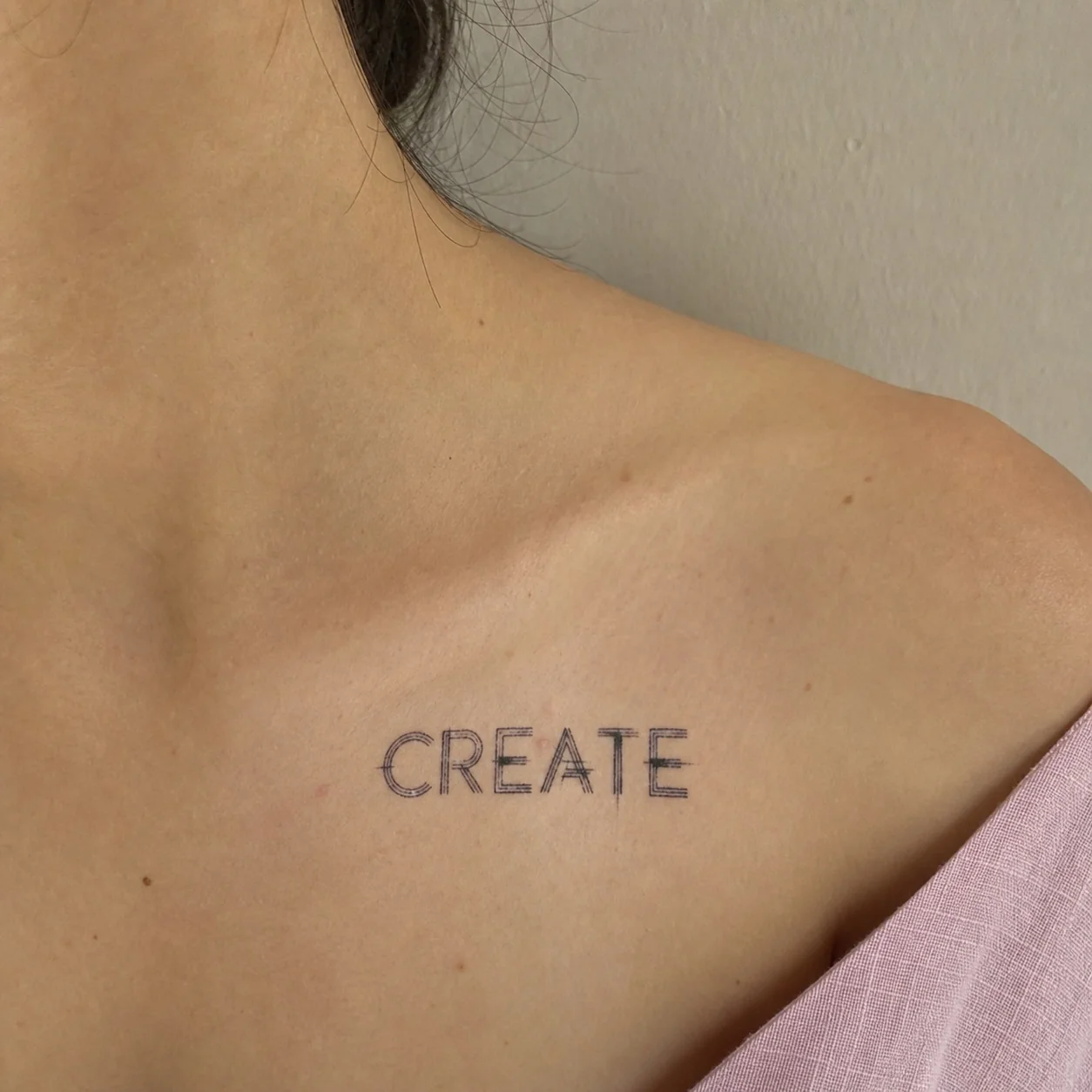CREATE temporary tattoo in spaced capitals