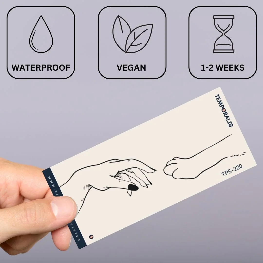 Hand touching cat paw temporary tattoo - Image 3