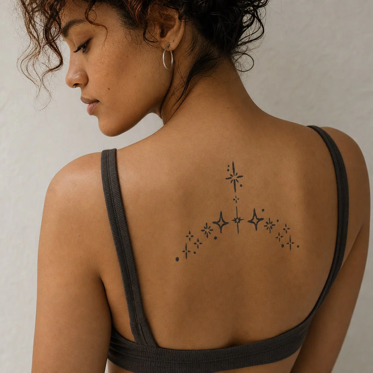 Scattered Star Sparkle Tattoo