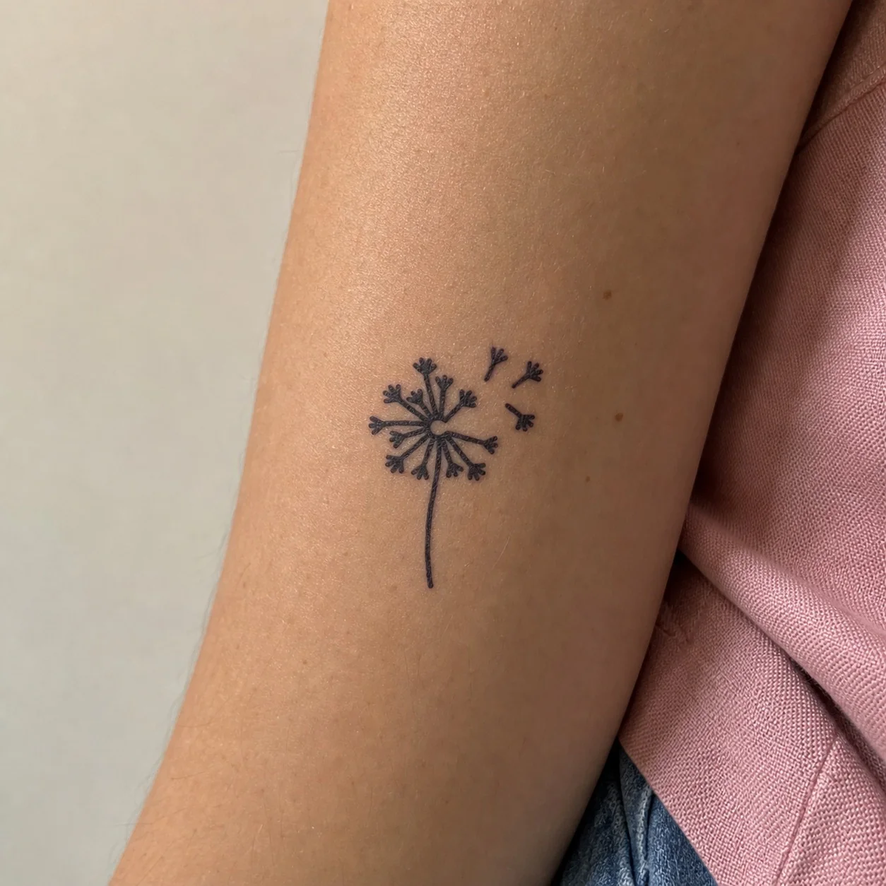 Dandelion temporary tattoo with blowing seeds